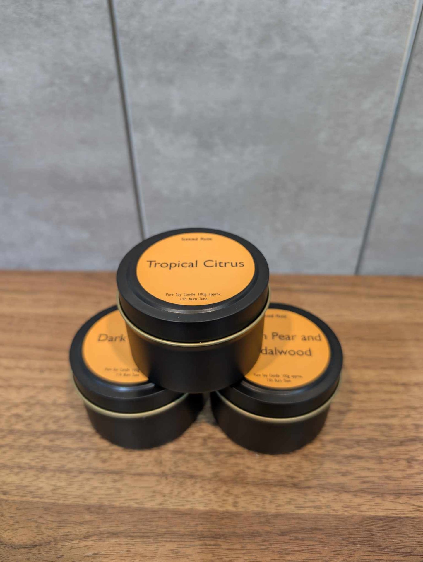 3 candle tins forming a mini pyramid